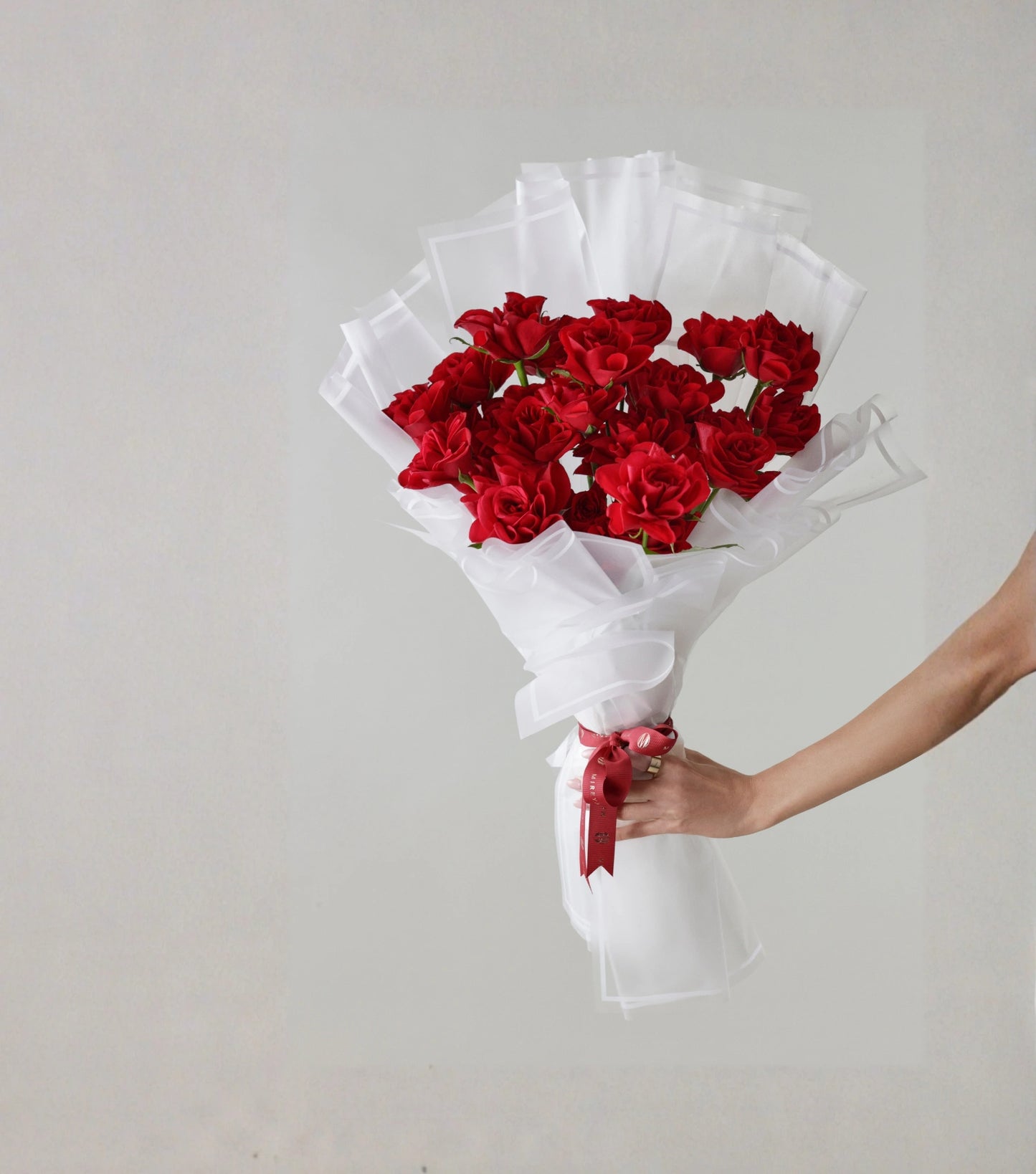 Front view of crimson red roses hand-tied luxury bouquet — The Sculpted Rose Bouquet by Mireyaa, Mumbai same-day delivery