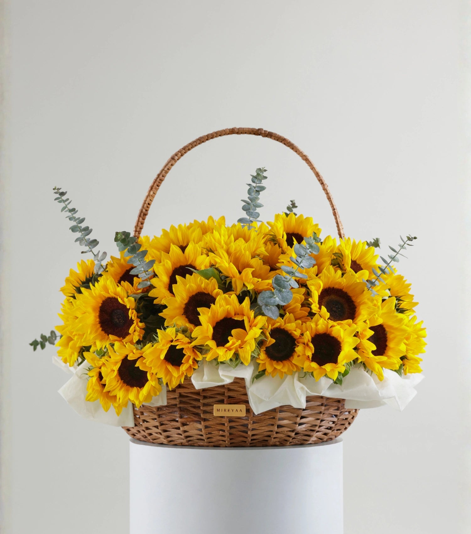 Front view of Grande size sunflowers in a water hyacinth estate basket — The Sunfield Estate Basket by Mireyaa, Mumbai same-day delivery