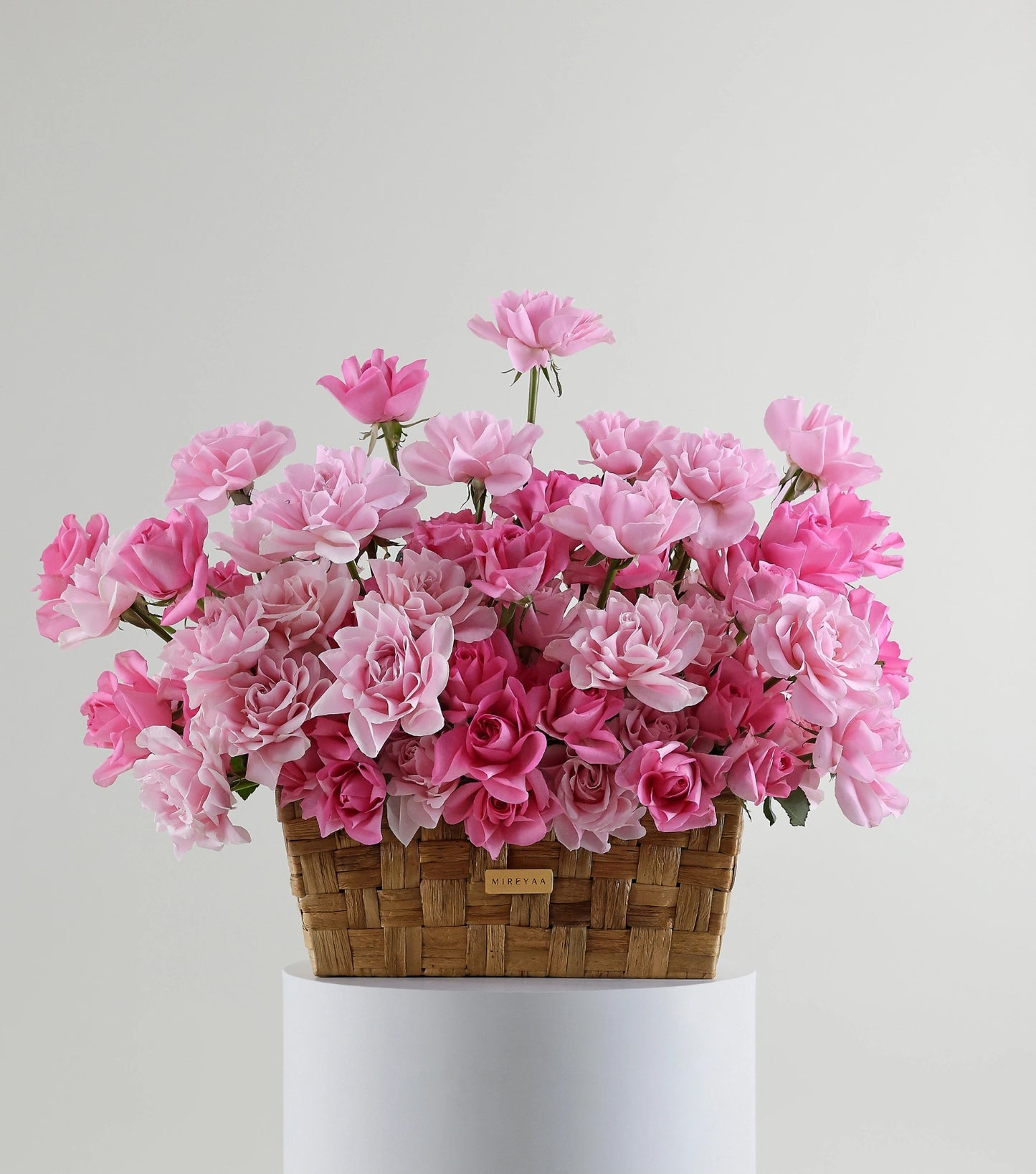 Front view of blush pink roses in a low rectangular basket — The Sculpted Rose Rectangular Basket by Mireyaa, Mumbai same-day delivery