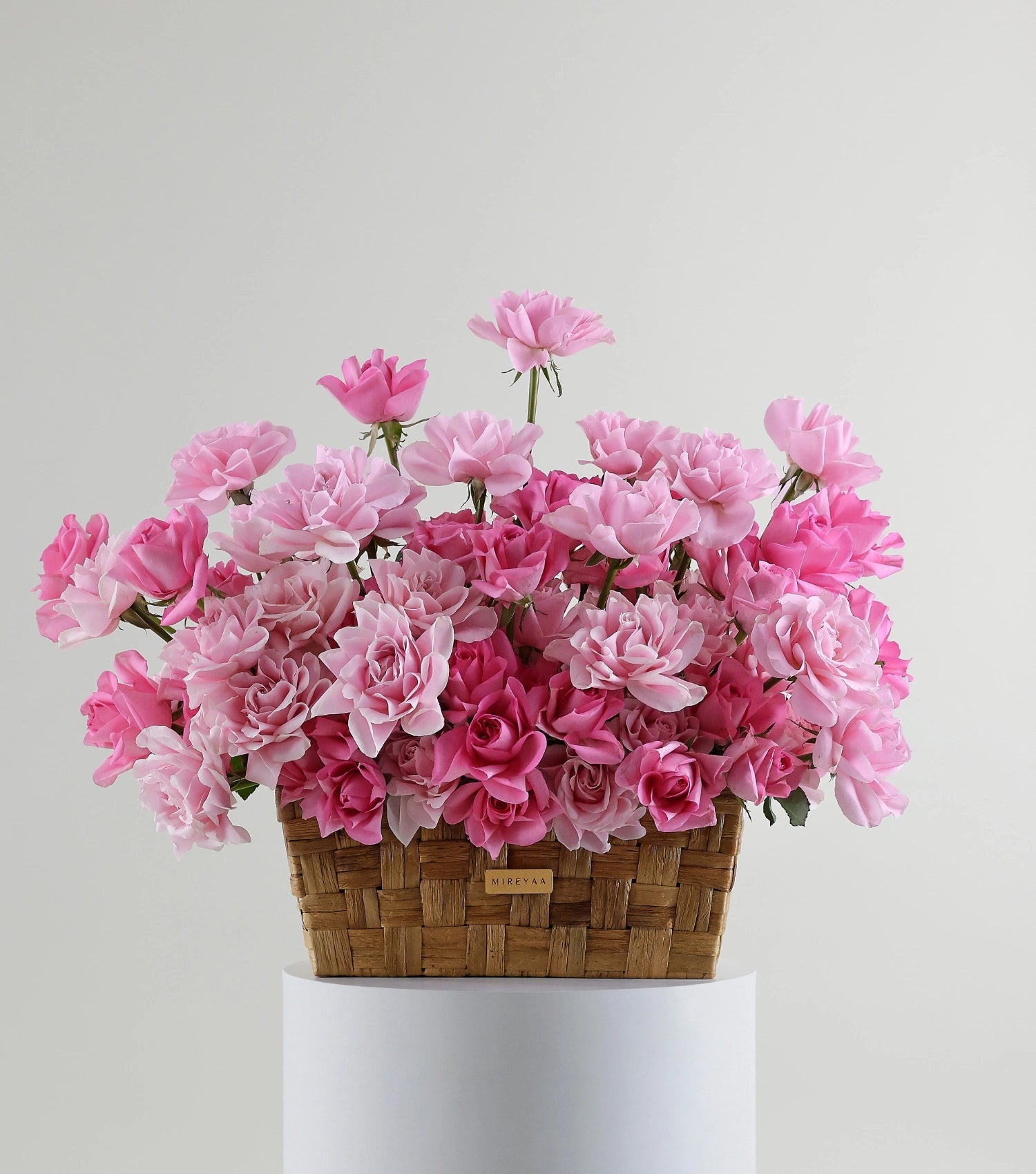 Front view of blush pink roses in a low rectangular basket — The Sculpted Rose Rectangular Basket by Mireyaa, Mumbai same-day delivery