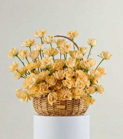 Front view of apricot roses in a water hyacinth estate basket — The Sculpted Rose Estate Basket by Mireyaa, Mumbai same-day delivery