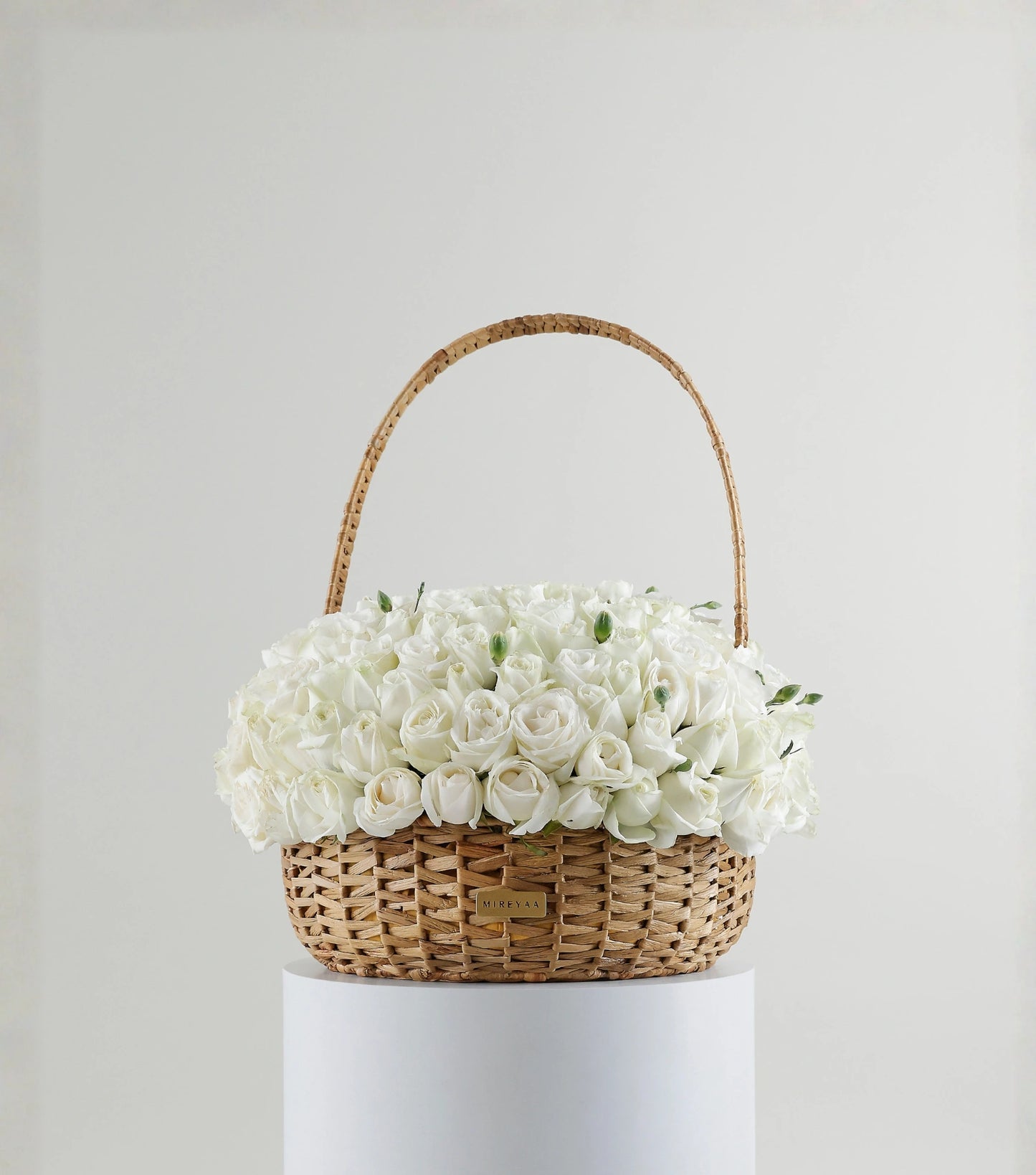 Front view of ivory white rose dome in a water hyacinth estate basket — The Grand Rose Estate Basket by Mireyaa