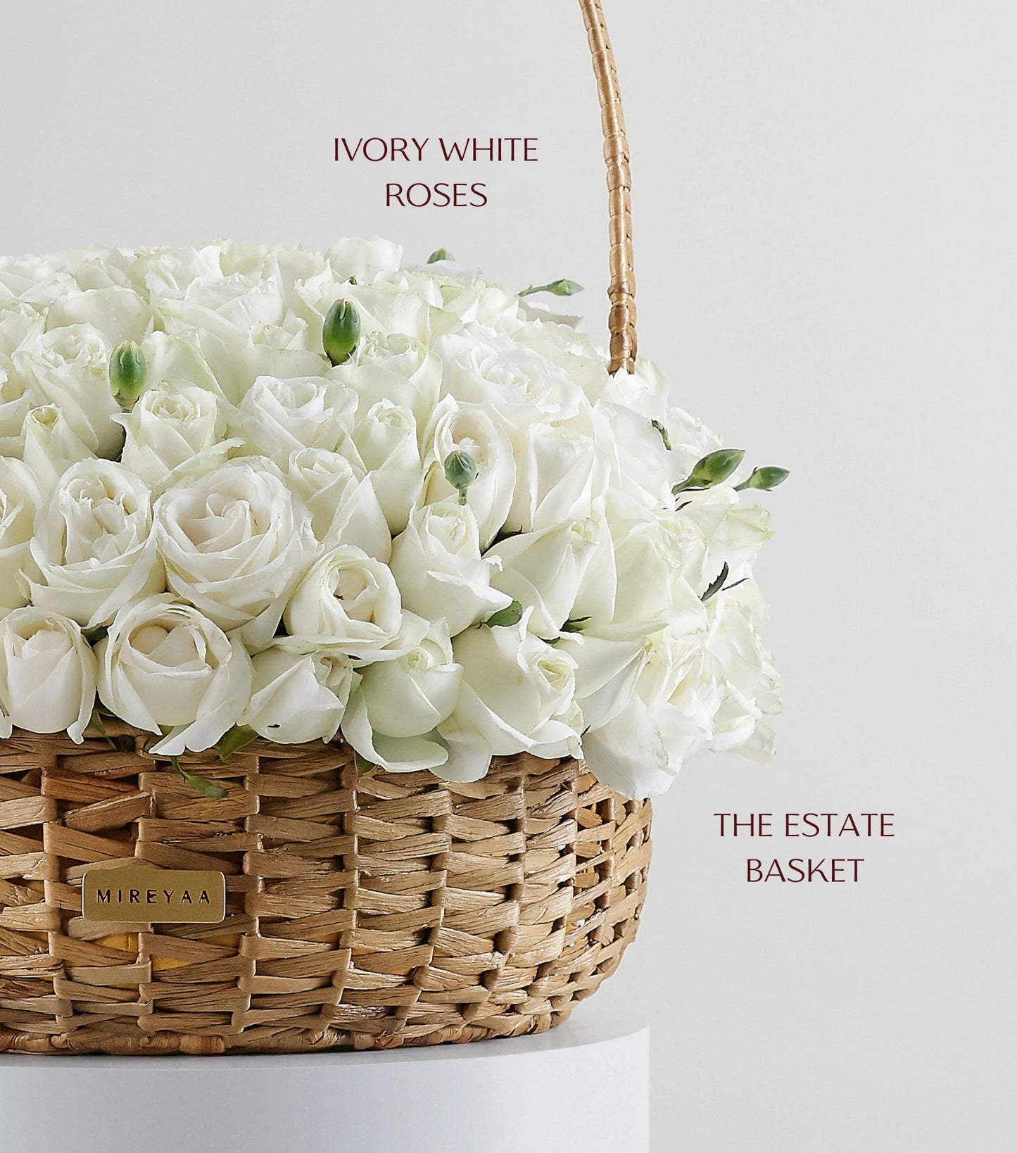 Close-up of ivory white roses in a handwoven water hyacinth estate basket — The Grand Rose Estate Basket by Mireyaa