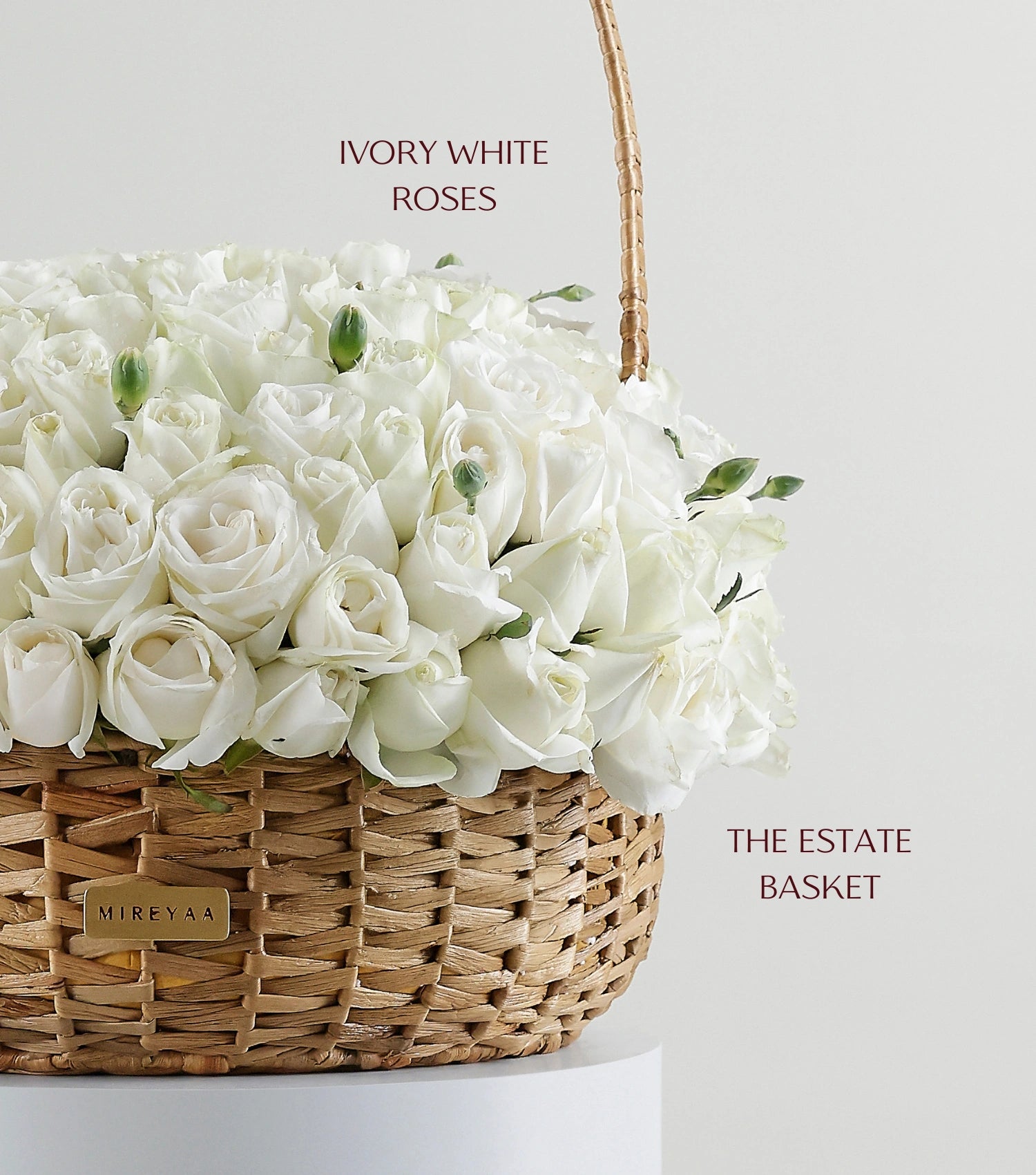 Close-up of ivory white roses in a handwoven water hyacinth estate basket — The Grand Rose Estate Basket by Mireyaa