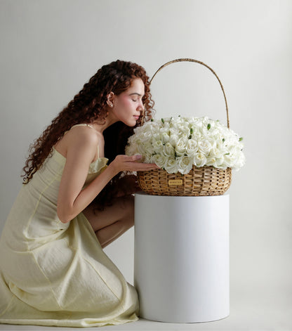 Ivory white roses arranged as a hand-composed dome in a water hyacinth estate basket — The Grand Rose Estate Basket by Mireyaa
