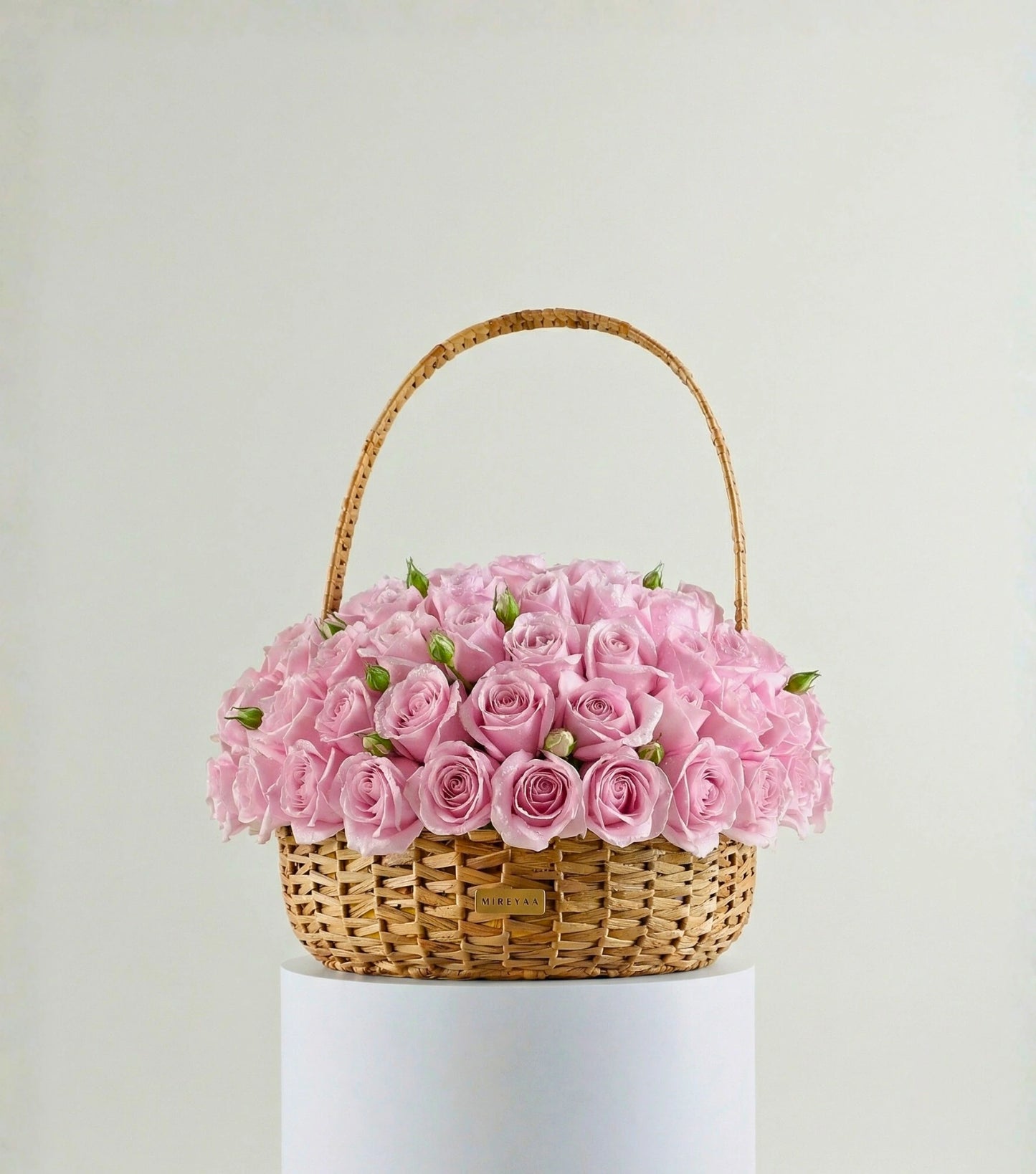 Soft pink roses in a water hyacinth estate basket — colour variant of The Grand Rose Estate Basket by Mireyaa