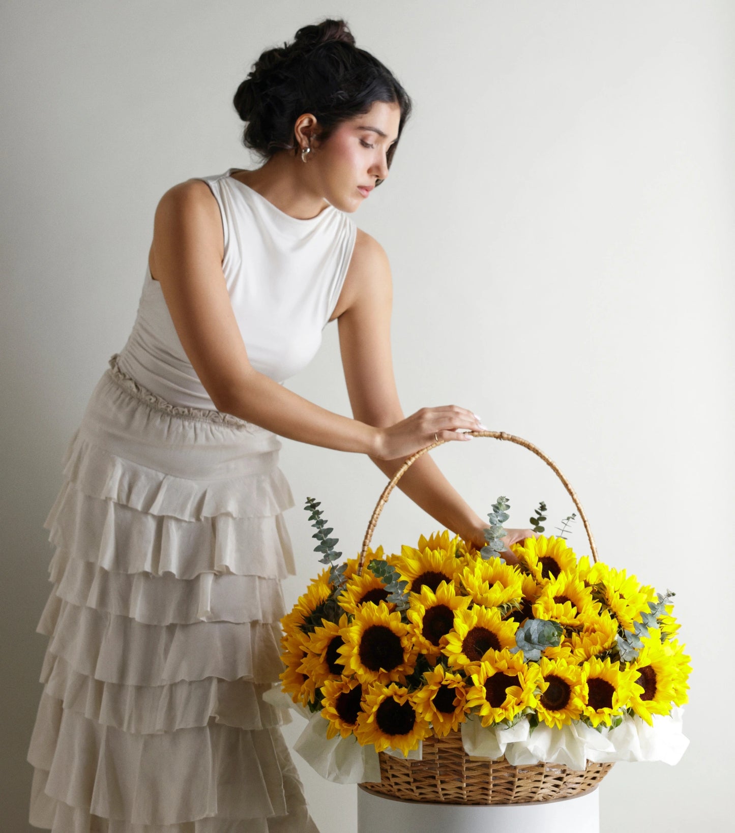 Side view of Grande size sunflowers in a water hyacinth estate basket — The Sunfield Estate Basket by Mireyaa, Mumbai same-day delivery