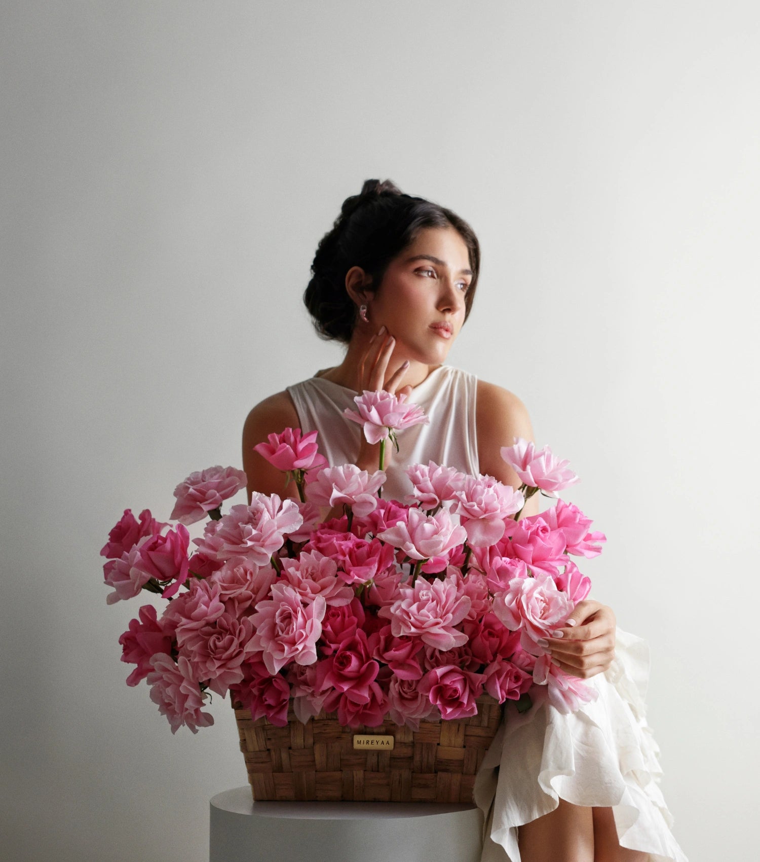Side view of blush pink roses in a low rectangular basket — The Sculpted Rose Rectangular Basket by Mireyaa, Mumbai same-day delivery