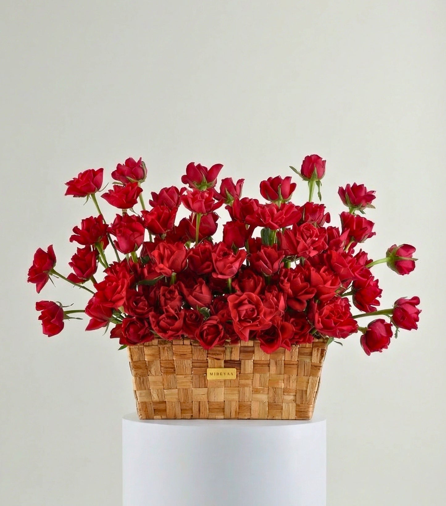 Front view of crimson red roses in a low rectangular basket — The Deep Rose Rectangular Basket by Mireyaa, Mumbai same-day delivery