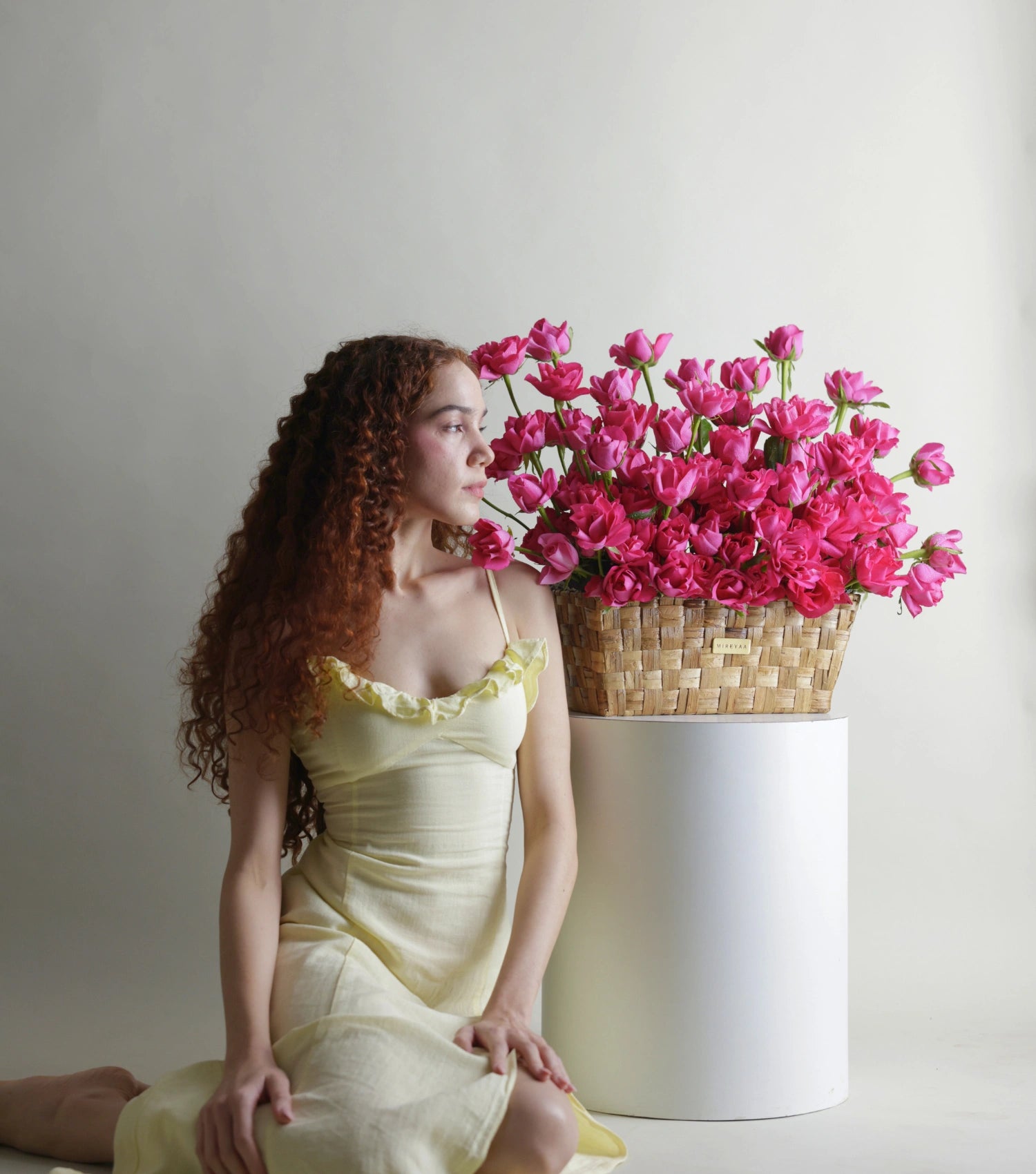 Detail of deep pink roses in a low rectangular basket — The Deep Rose Rectangular Basket by Mireyaa, Mumbai same-day delivery