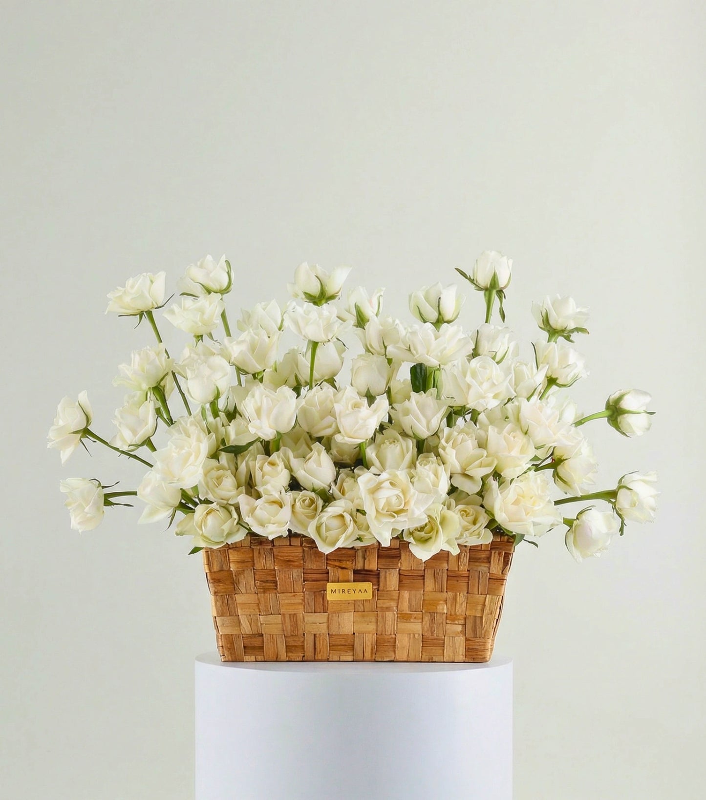 Front view of ivory white roses in a low rectangular basket — The Deep Rose Rectangular Basket by Mireyaa, Mumbai same-day delivery