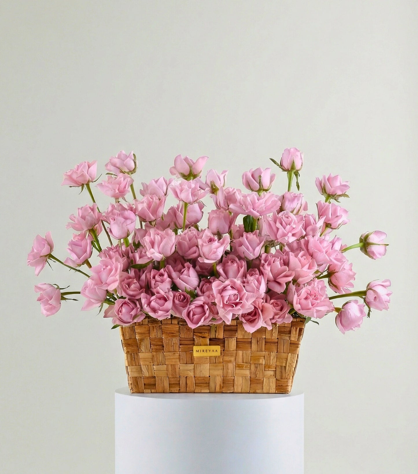 Front view of soft pink roses in a low rectangular basket — The Deep Rose Rectangular Basket by Mireyaa, Mumbai same-day delivery