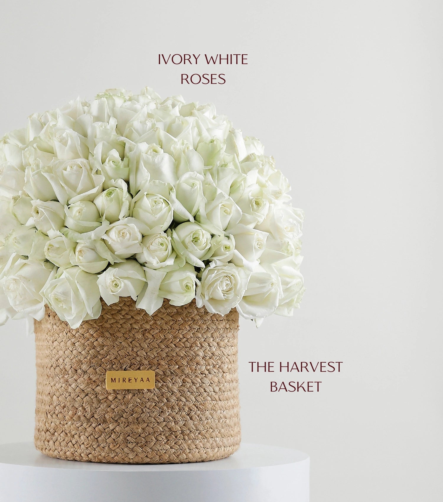 Close-up of ivory white roses in a handwoven jute harvest basket — The Ivory Harvest Basket by Mireyaa, Mumbai same-day delivery