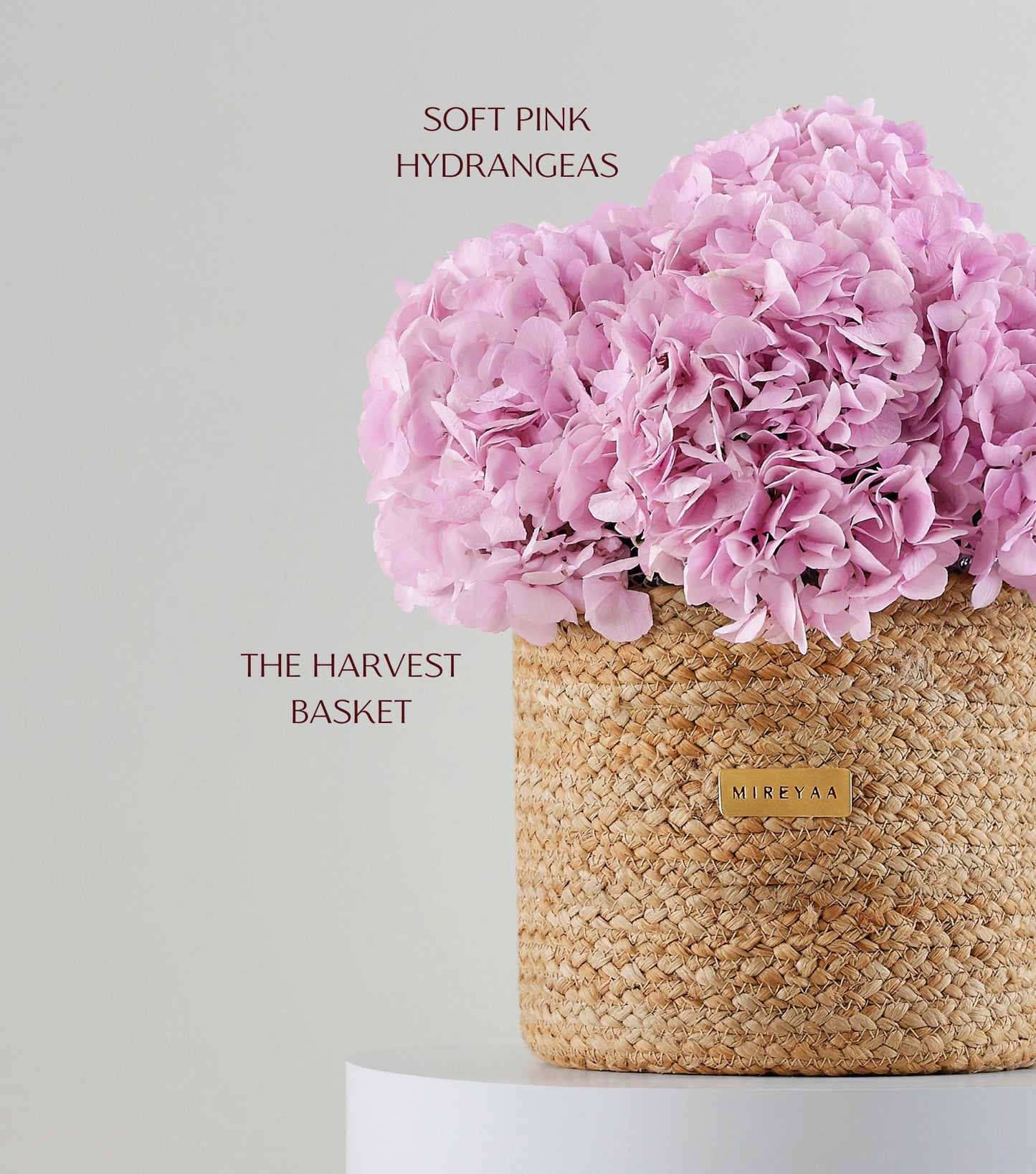 Side view of soft pink hydrangeas in a jute basket — variant of The Blue Hydrangea Harvest Basket by Mireyaa