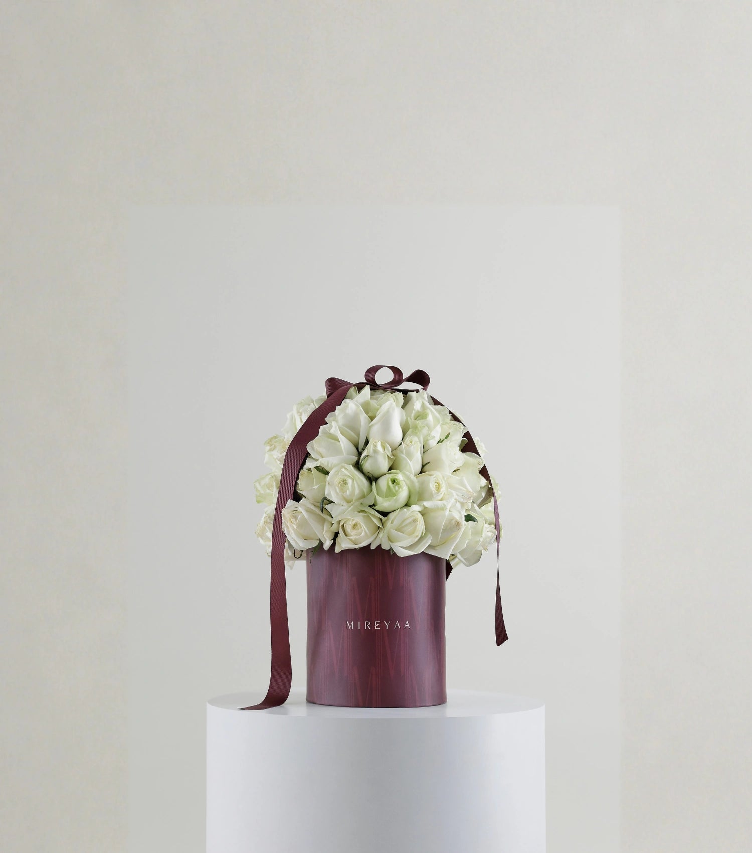 Front view of ivory white rose composition in Mireyaa Classic Hat Box
