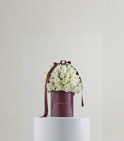 Front view of ivory white rose composition in Mireyaa Classic Hat Box
