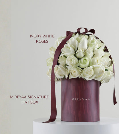 Detail of ivory white roses in branded Classic Hat Box by Mireyaa