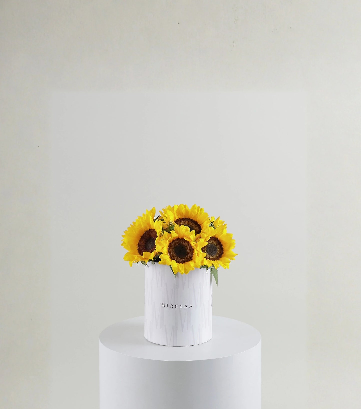 Front view of sunflowers in a Mireyaa Classic Hat Box — The Sunflower Yellow Classic Hat Box by Mireyaa, Mumbai same-day delivery