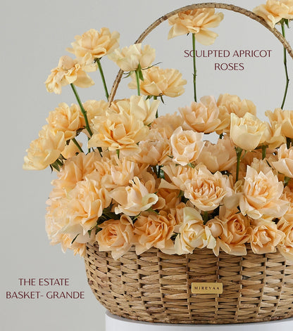 Close-up of Grande size apricot roses in a water hyacinth estate basket — The Sculpted Rose Estate Basket by Mireyaa, Mumbai same-day delivery