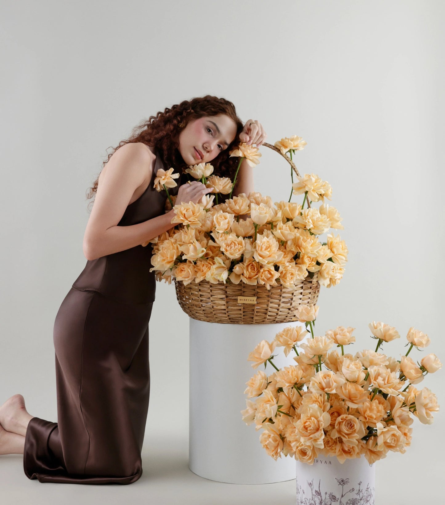 Detail of Grande size apricot roses in a water hyacinth estate basket — The Sculpted Rose Estate Basket by Mireyaa, Mumbai same-day delivery