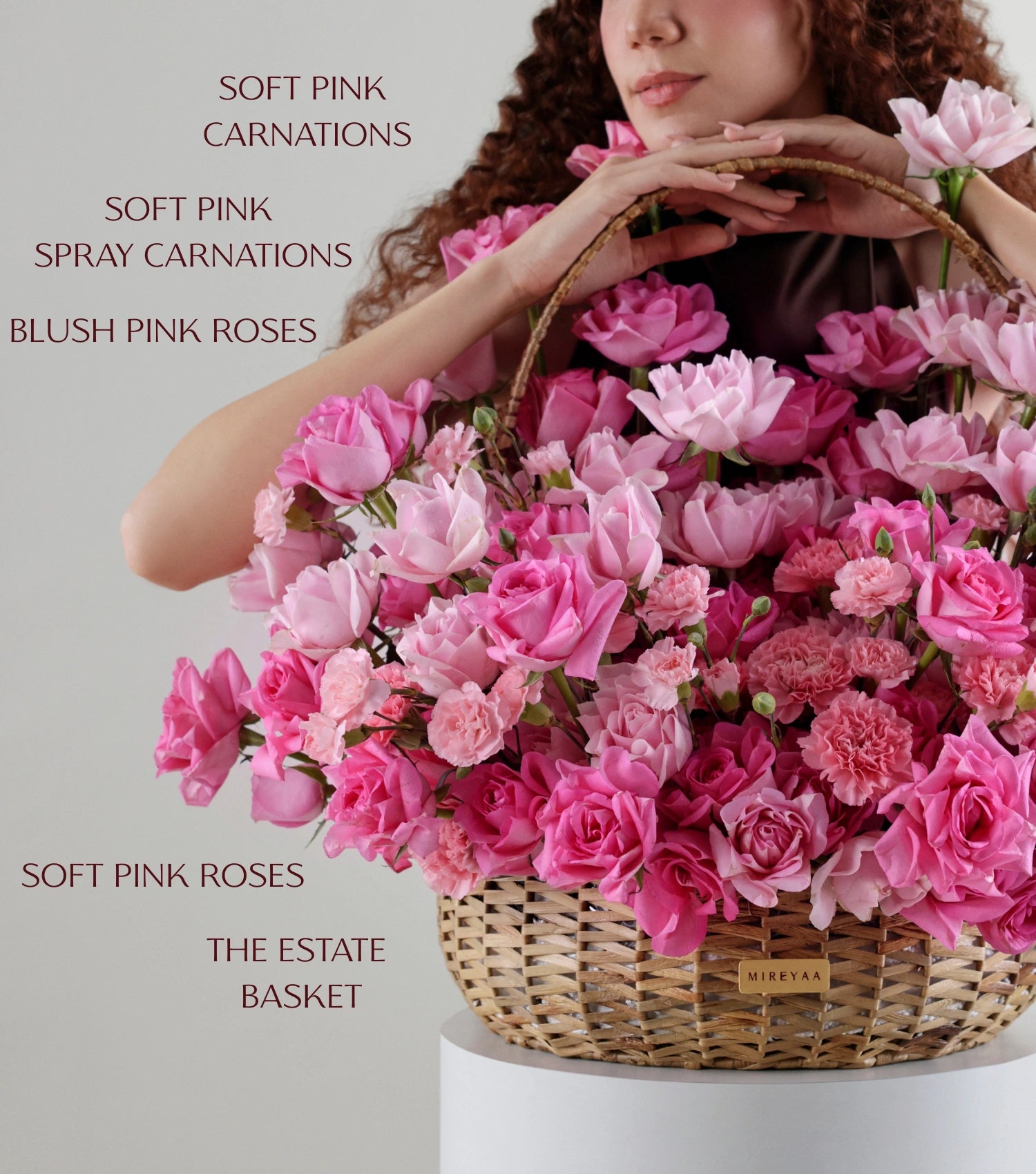 Close-up of blush pink roses in a water hyacinth estate basket — The Petal Study Estate Basket by Mireyaa, Mumbai same-day delivery