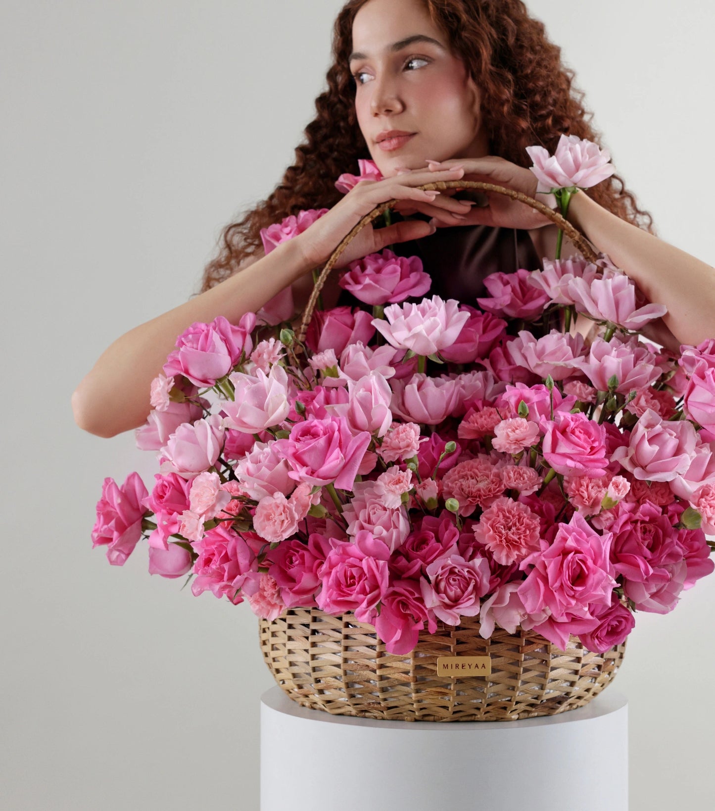 Side view of blush pink roses in a water hyacinth estate basket — The Petal Study Estate Basket by Mireyaa, Mumbai same-day delivery